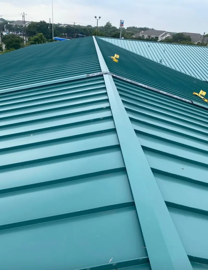 Green commercial metal roof ridge and valley for Metal Roof Repair in Sioux Falls