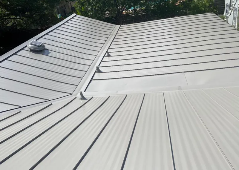 Solar attic fan installed on a metal roof for Roof Ventilation in Sioux Falls